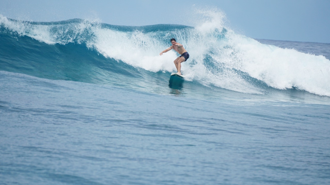 Surfing a breaking blue wave